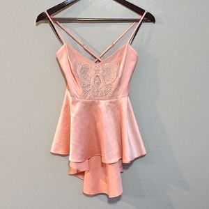 Bebe Peach Hi low silky top with criss cross strap back size small